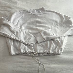 White mock neck sweatshirt